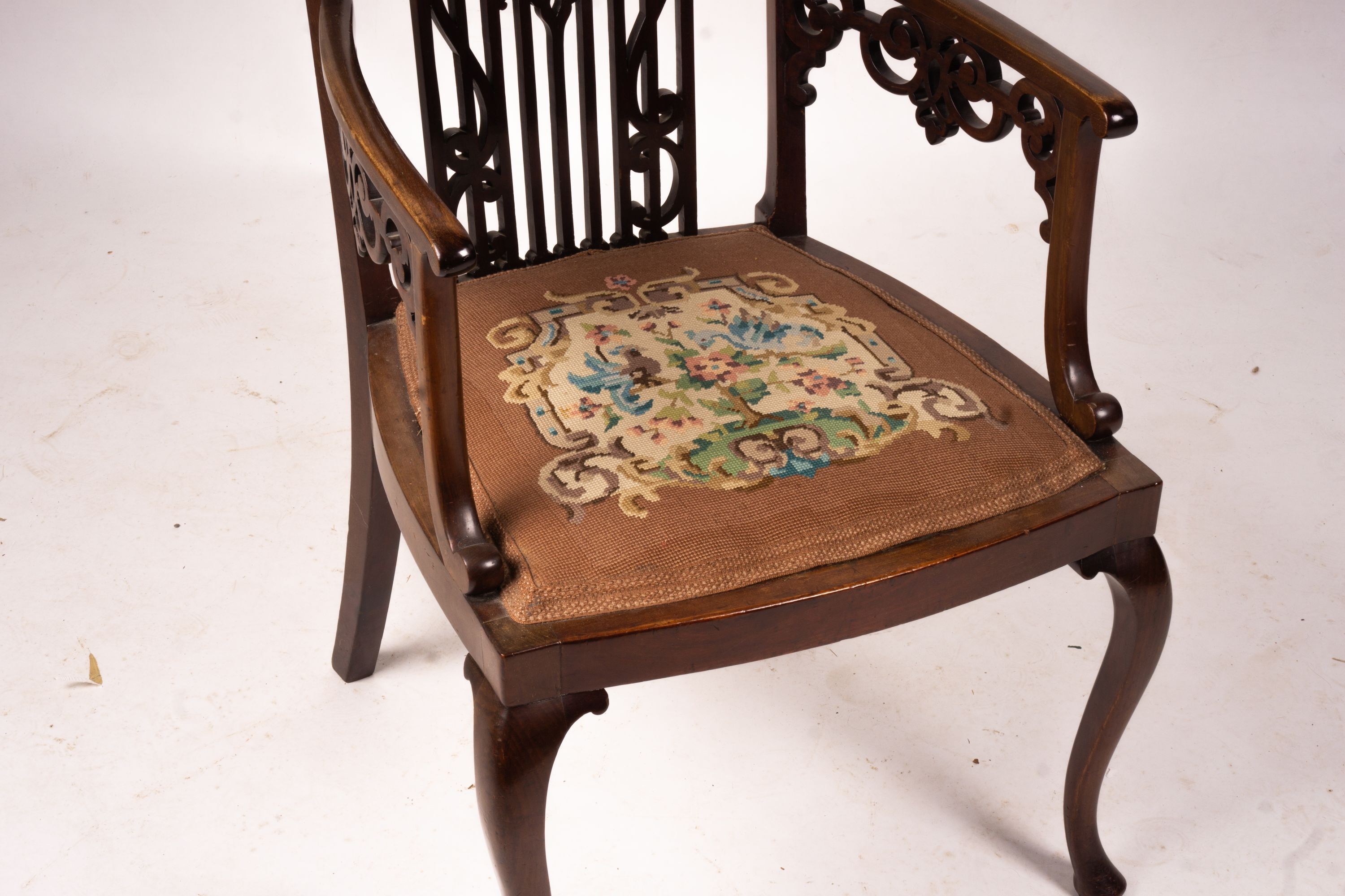 A late Victorian carved mahogany elbow chair